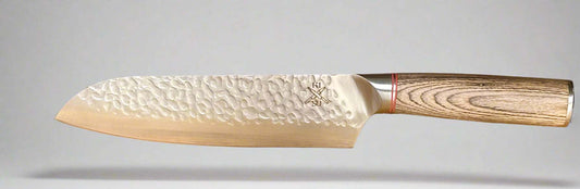 Rugged stainless steel Santuko chef knife with a pakka wood handle and hammer-forged blade.