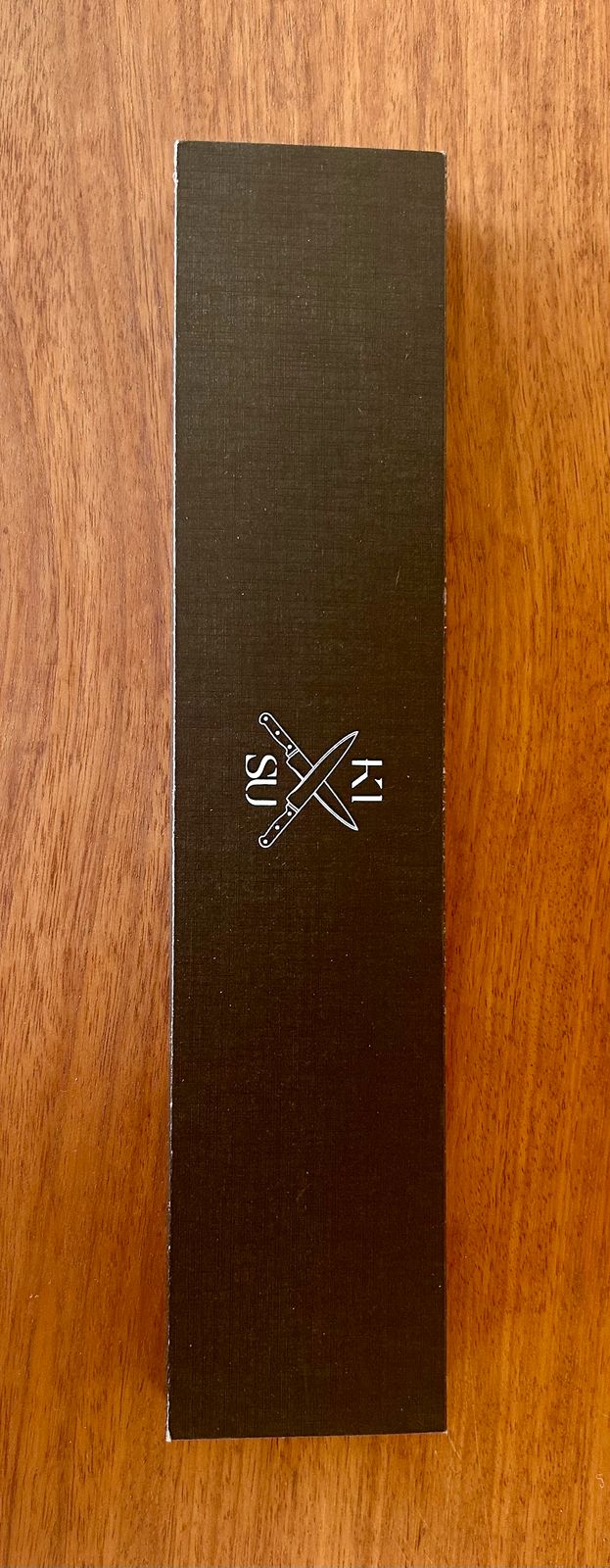 Tokai Range - Nakiri knife box with logo on a wooden surface.