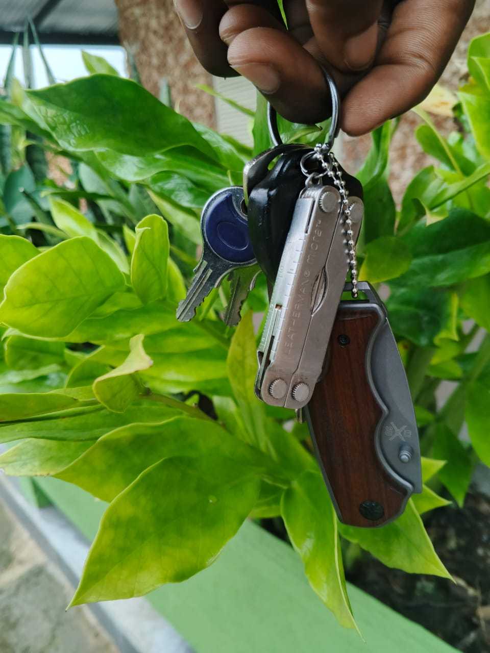 sleek key-ring knife with stainless steel blade and bottle opener