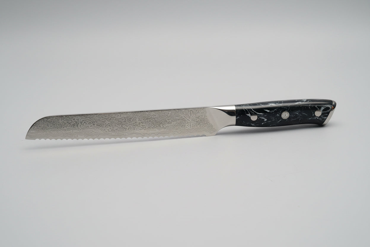 Bread Knife with a black handle on a gray background