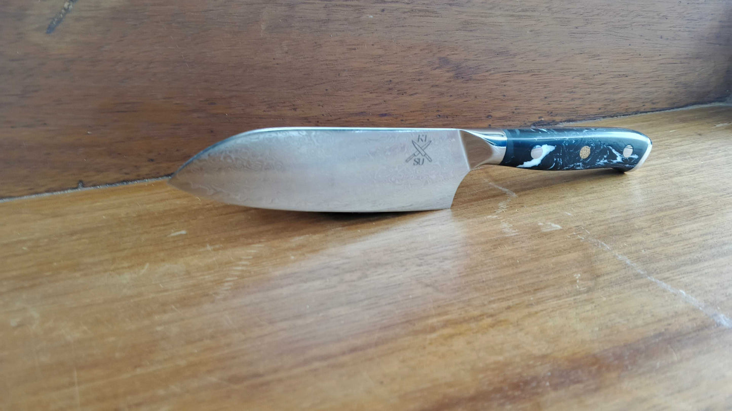 Santuko 7 inch knife with sharp blade on wooden surface