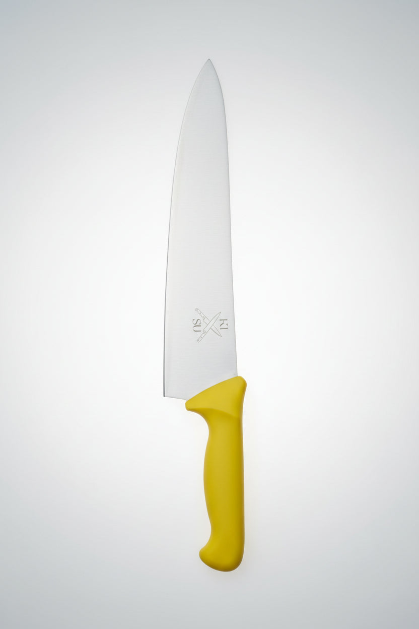 Knife with yellow handle and ruler on a wooden surface