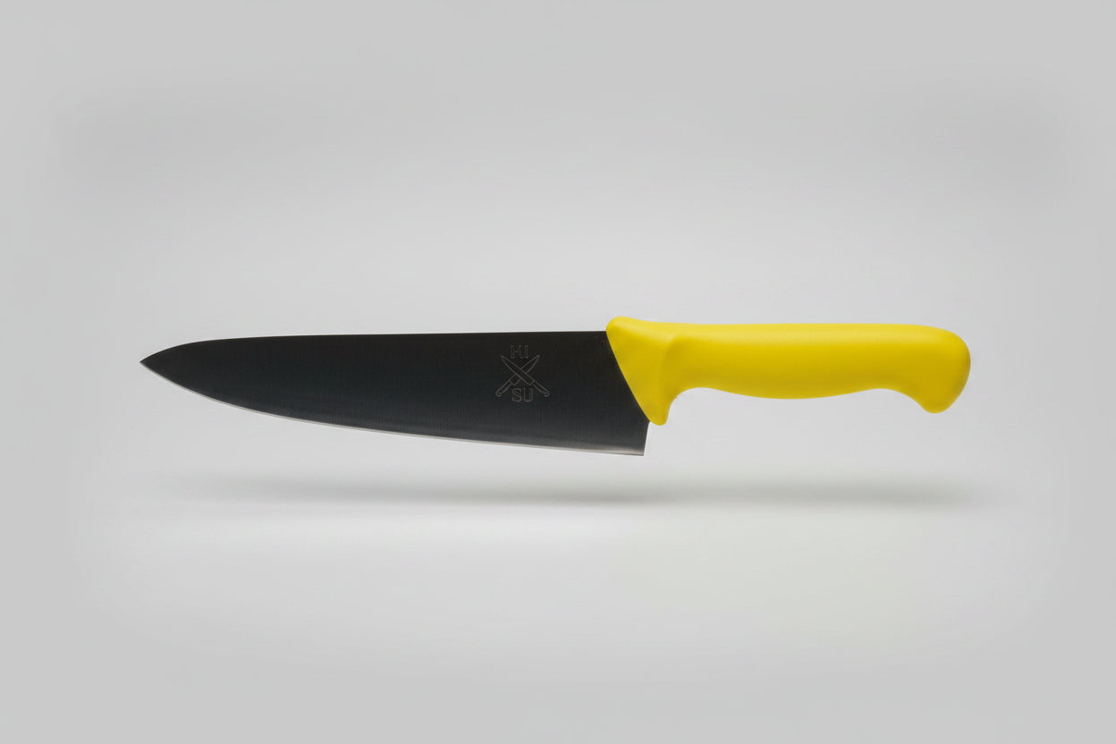 Knife with a yellow handle on a wooden surface