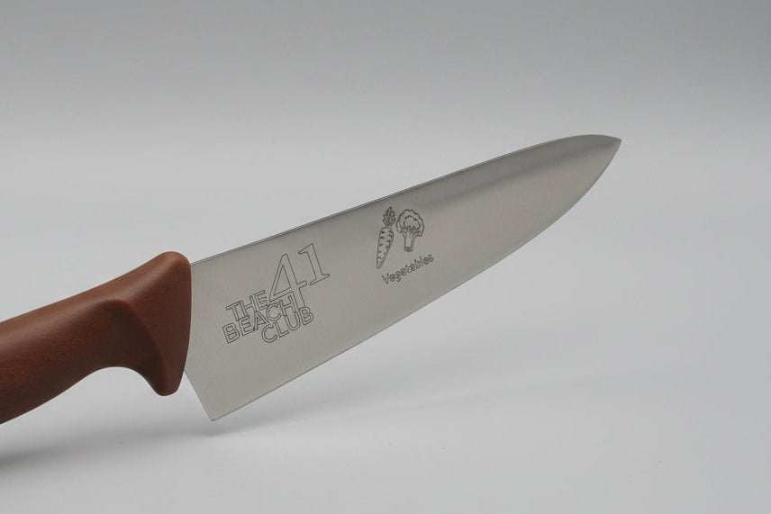 Knife with a brown handle on a gray background