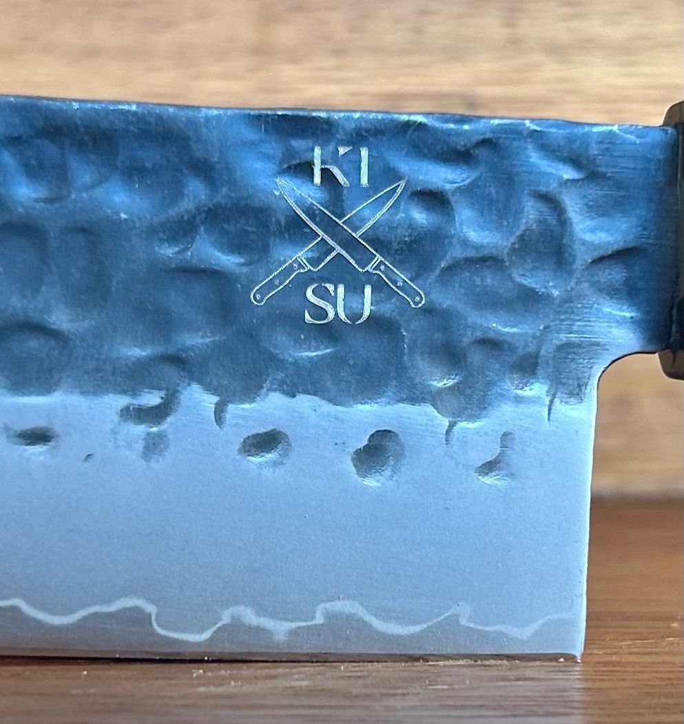 Tokai Range Santuko 5-inch knife blade featuring Damascus steel pattern and engraved logo.