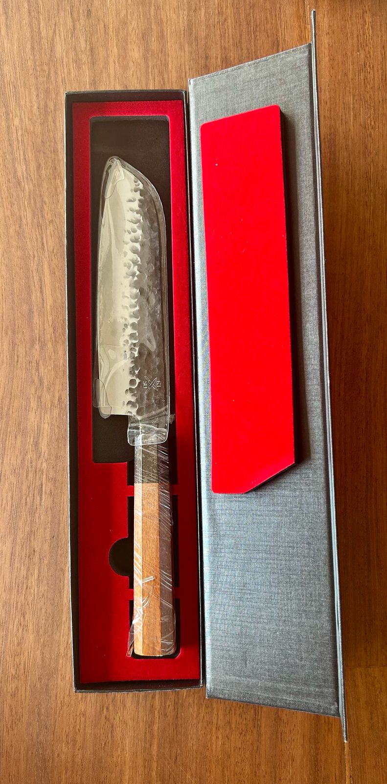 Tokai Range Santoku knife with AUS10 Damascus blade and Mkuruti wood handle in a gift box.