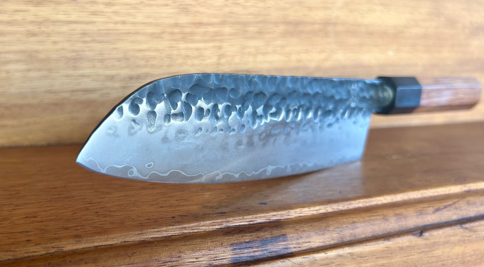 Tokai Range Santuko 7" Japanese chef knife with Damascus pattern blade and Mkuruti wood handle.