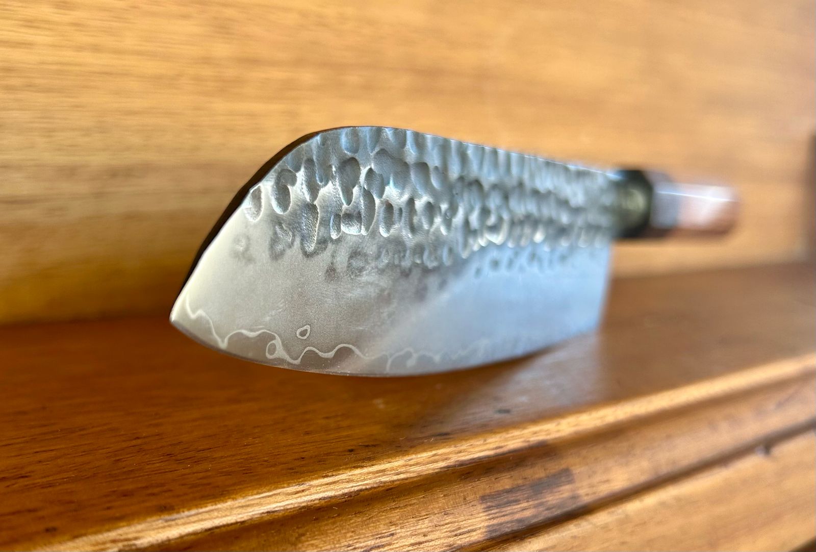 Tokai Range Santuko 7" Japanese Chef Knife with Damascus steel pattern and African Mkuruti wood handle.