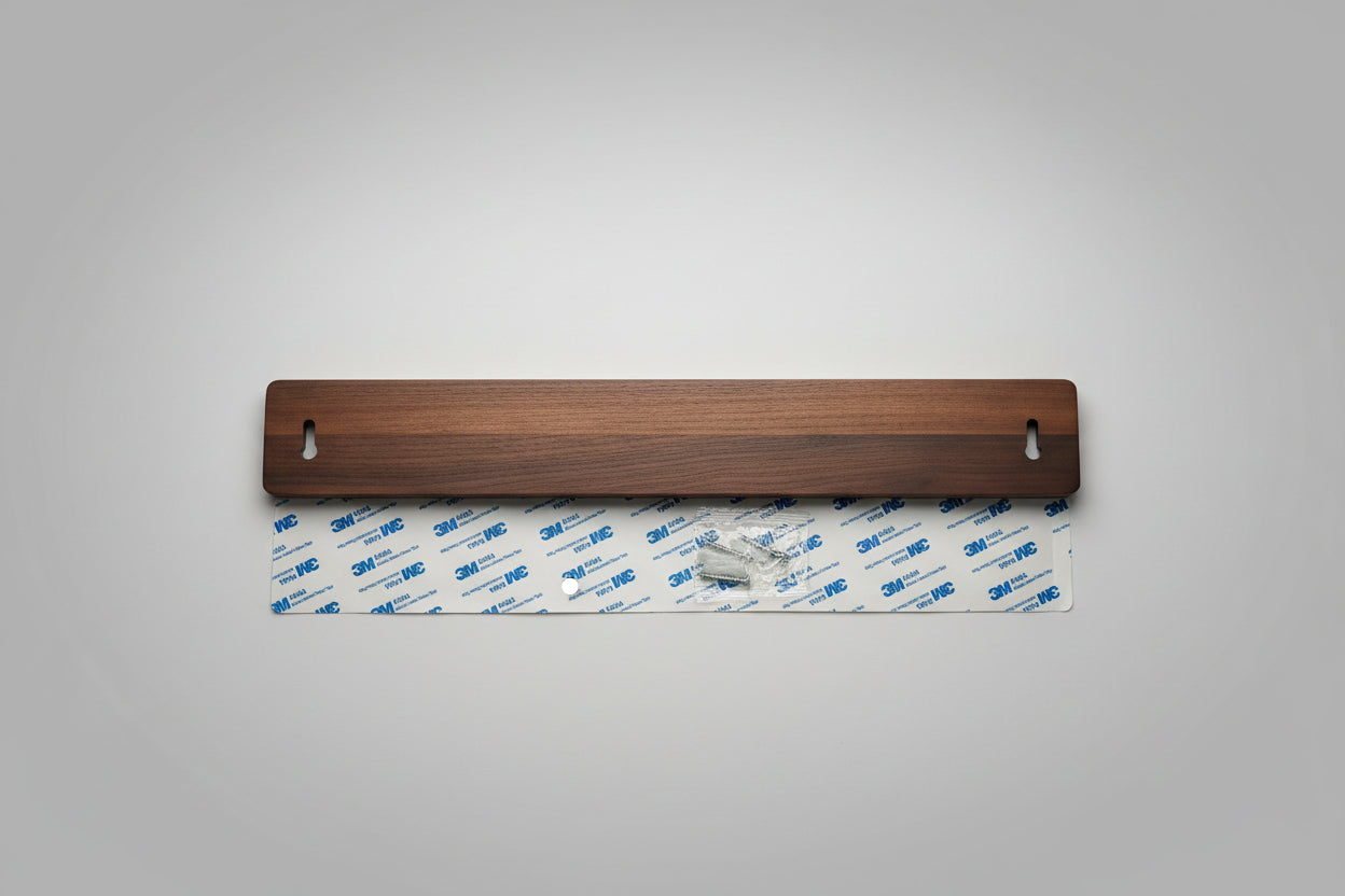 Wooden strip with 3M tape on a wooden surface